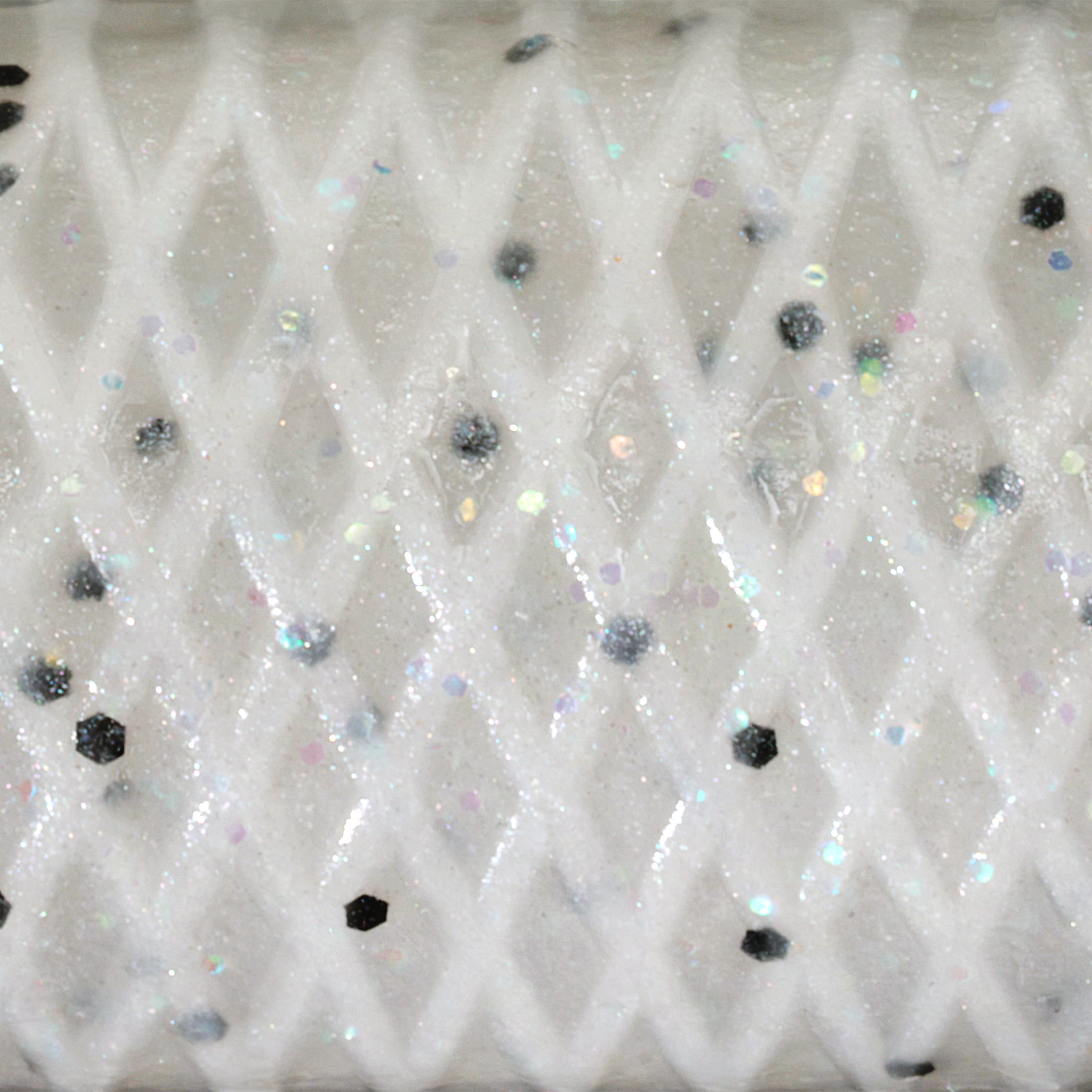 White mesh fabric with embedded black glitter and iridescent holographic flecks.